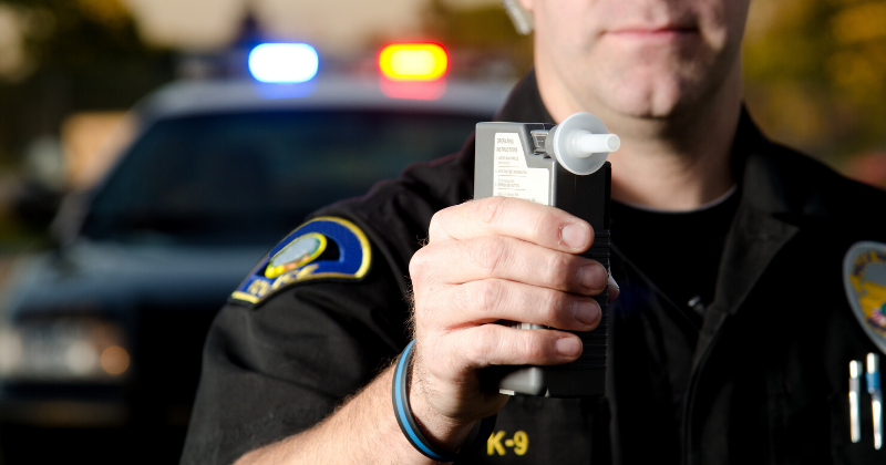 Police Officer Breathalyzer: DUI Convictions Restrict Citizenship Applications | Immigration Lawyer Mario Godoy | Godoy Law Office